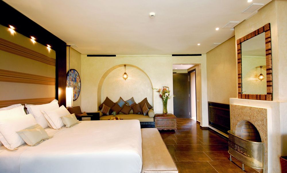 A hotel bedroom in warm evening light